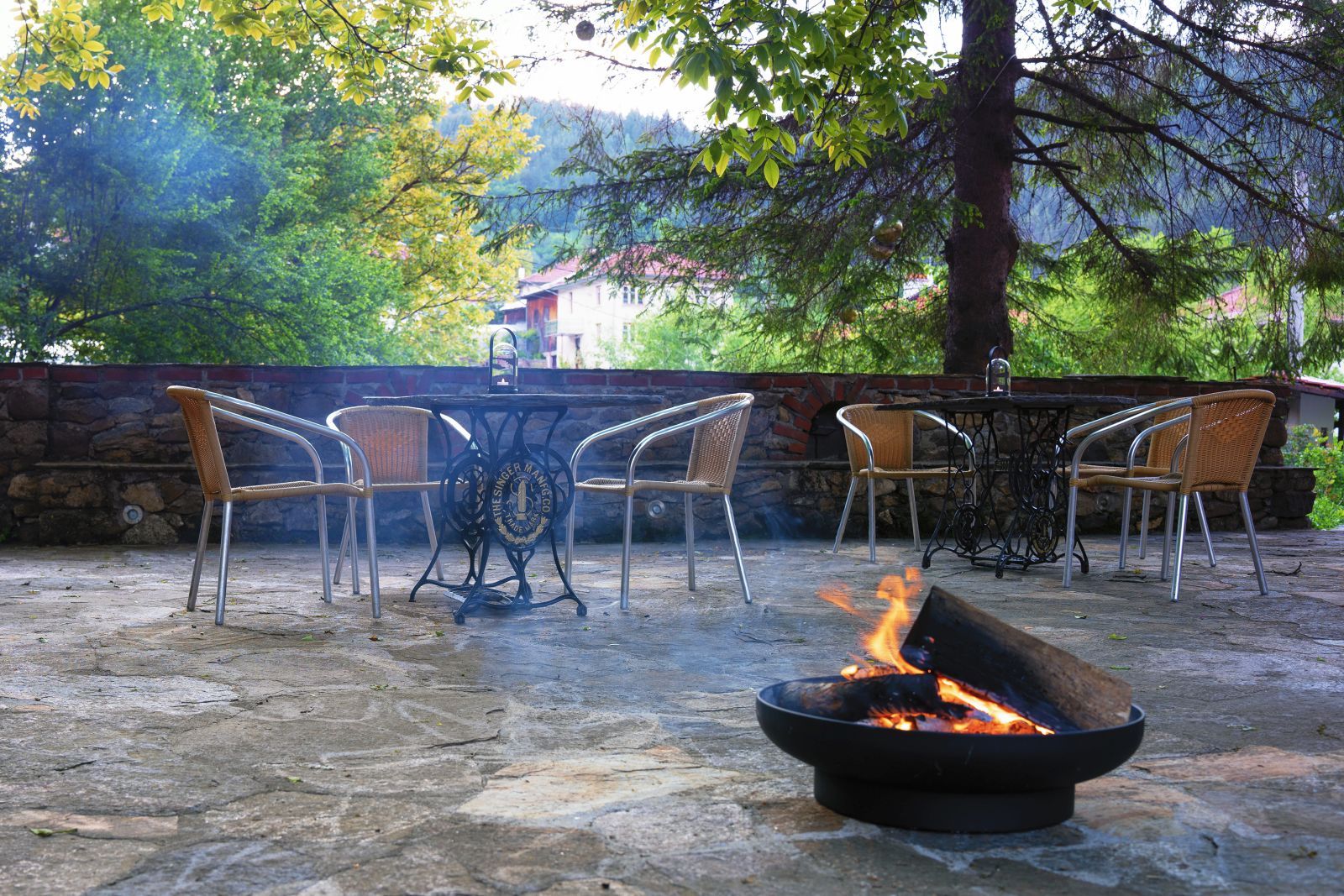 The terrace with the fire pit in the evening