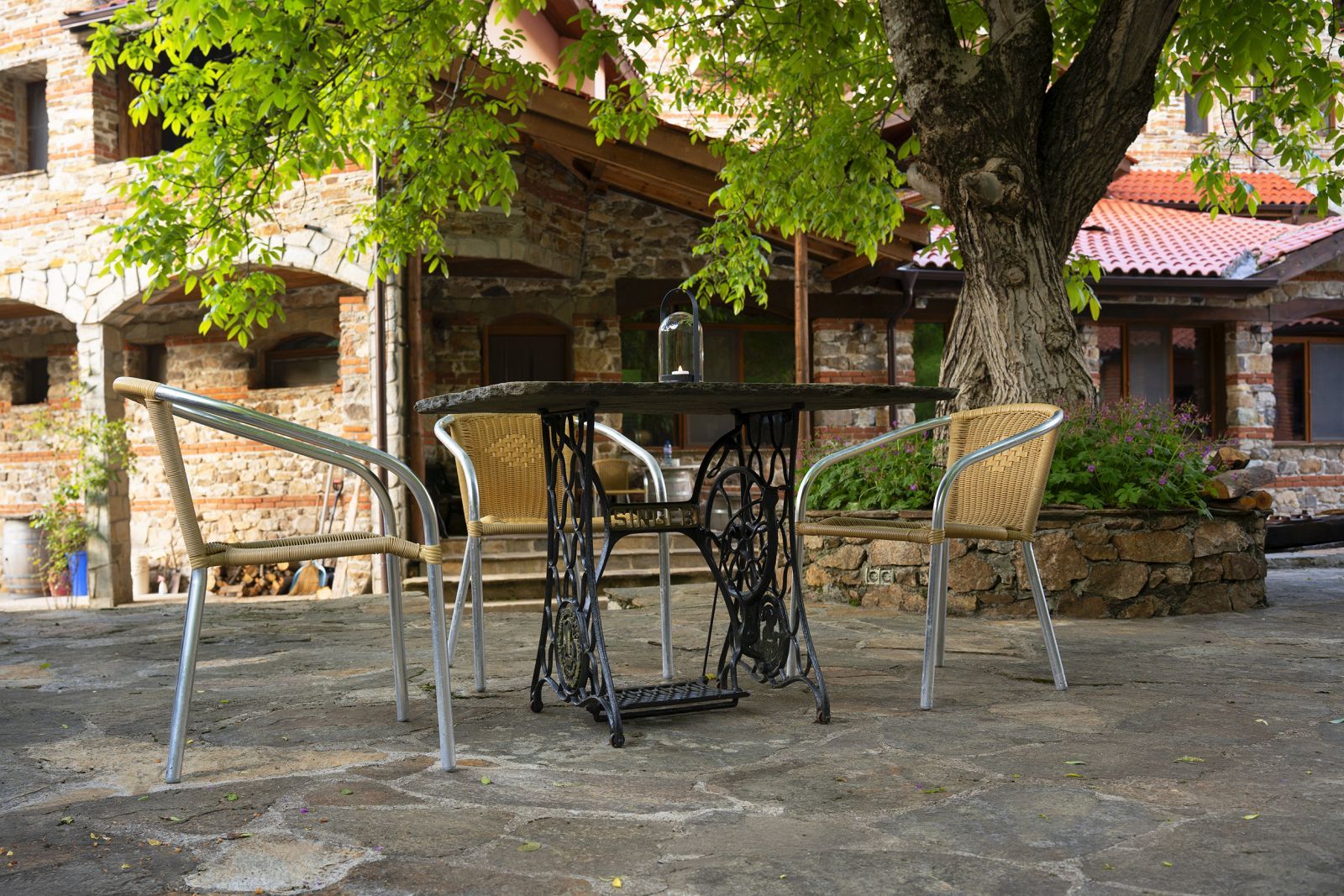 The hotel garden, with benches and flowers