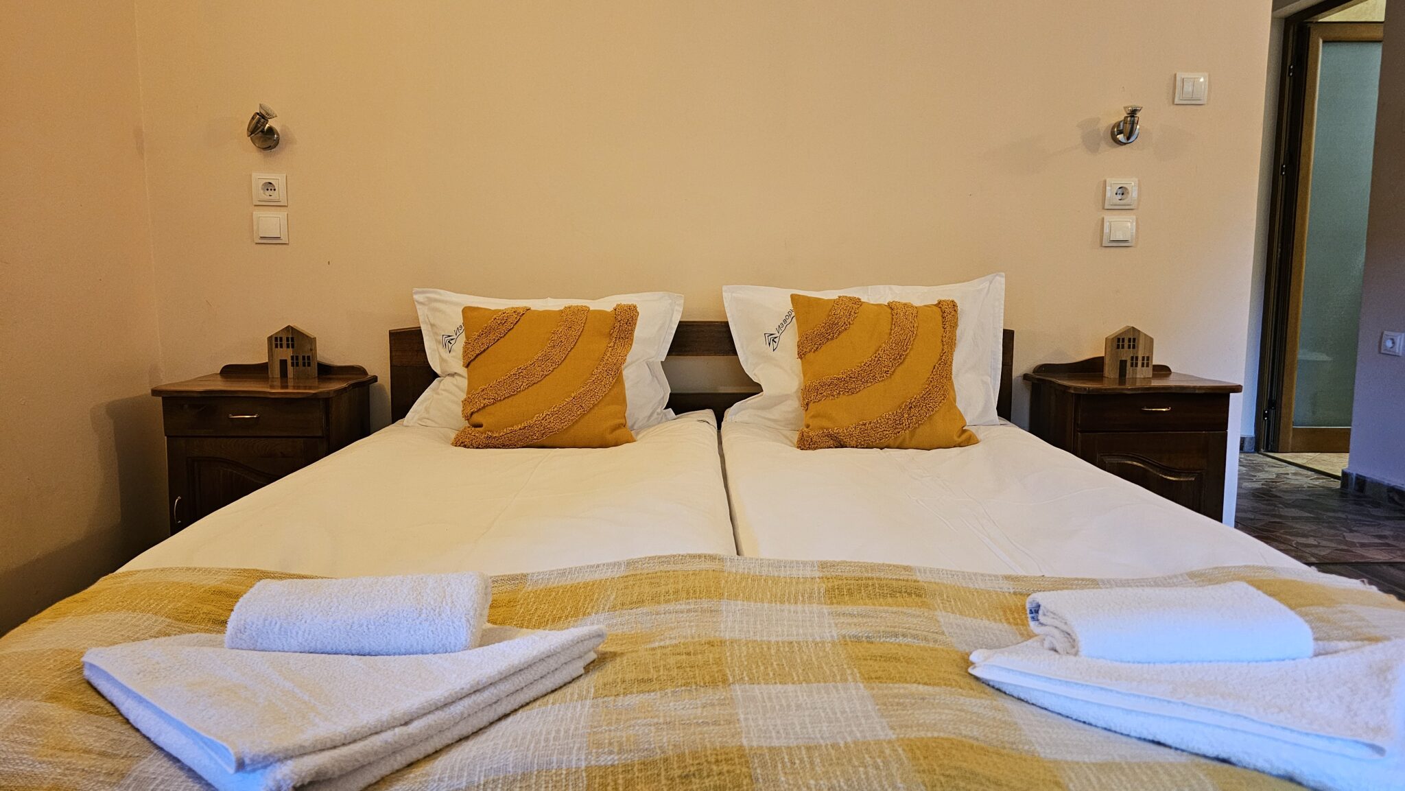 The double bed close up, with yellow cushions