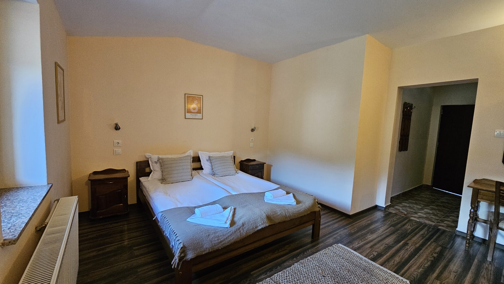 The bed with bedside tables on either side