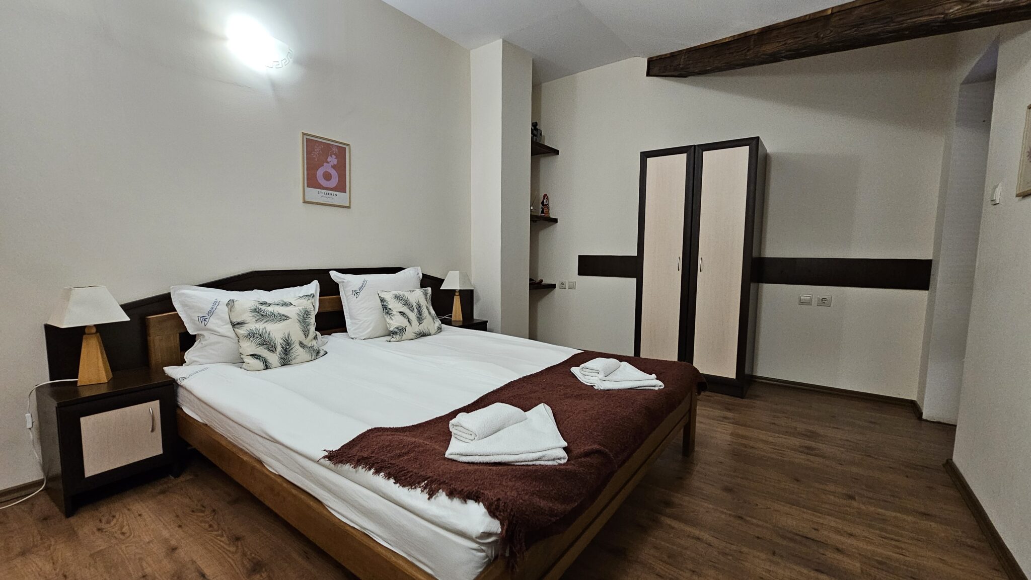 The bed and wardrobe under the sloping ceiling
