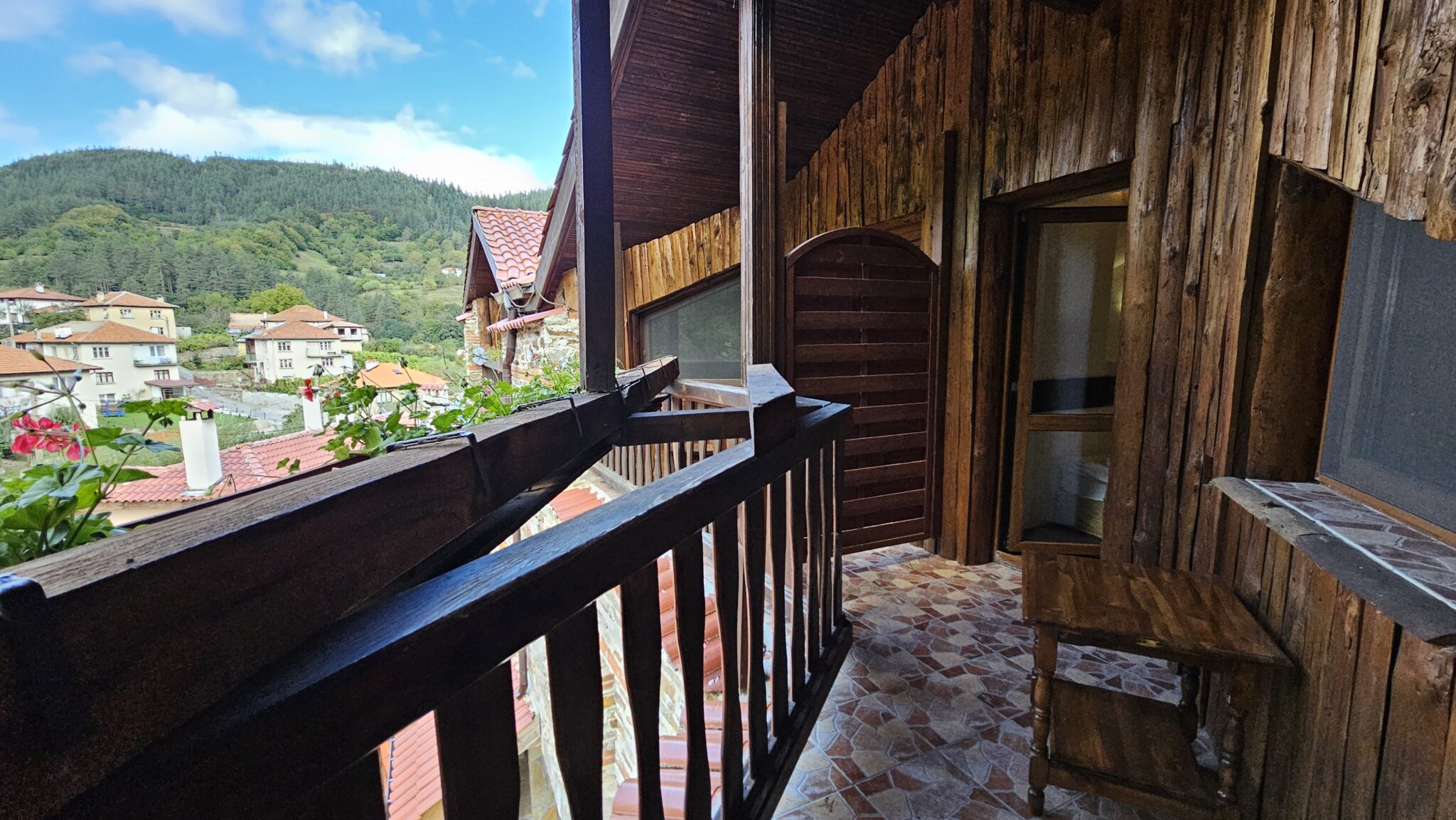 The view from the balcony over the village and its roofs