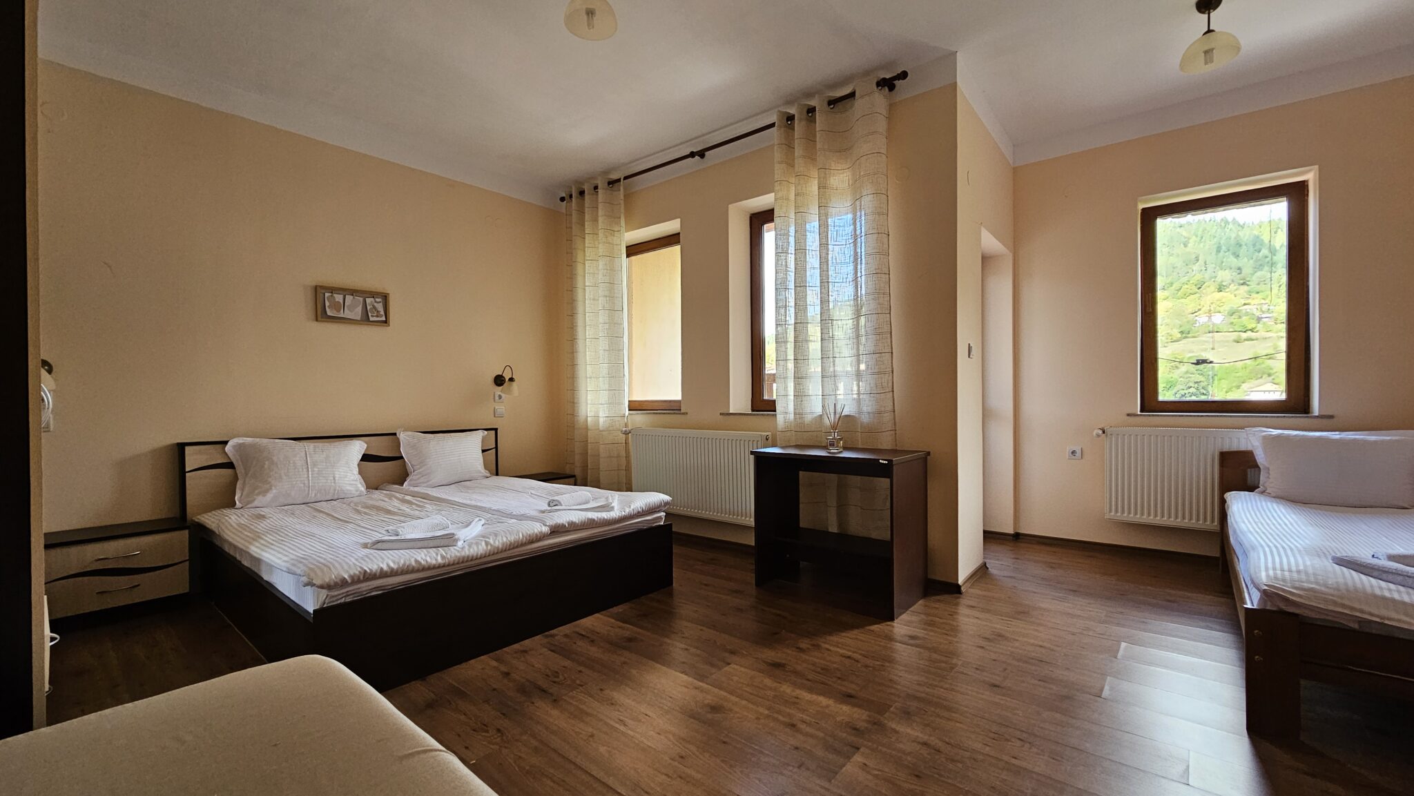 The bed and the desk by the window