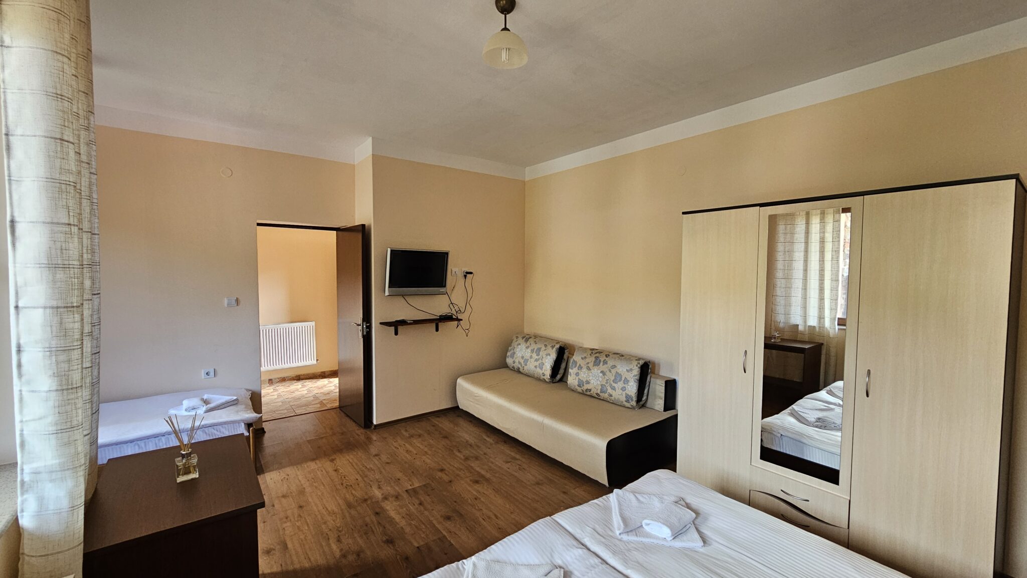 The sofa, television and wardrobe